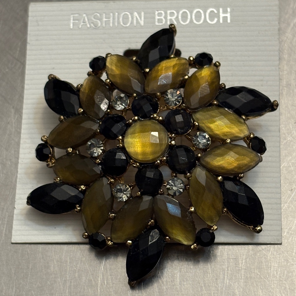 Elegant Black And Gold Brooch